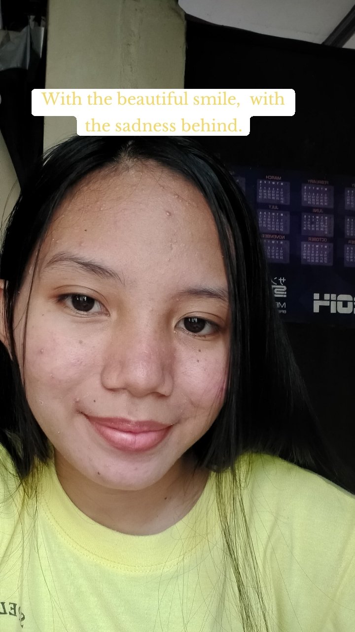 With the beautiful smile,  with the sadness behind.